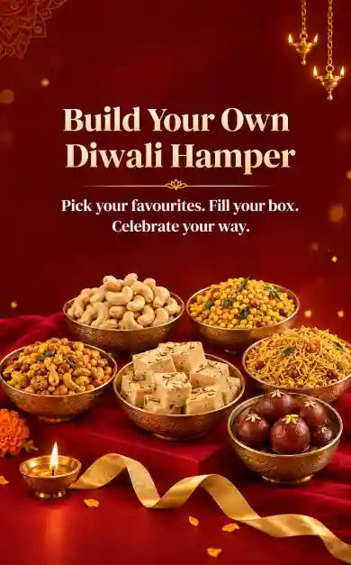 Build your own Diwali hamper — brass bowls of cashews, boondi, soan papdi, mixture and gulab jamun beside a lit diya