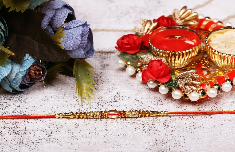 Golden Beads and Kundan Rakhi - Image 1