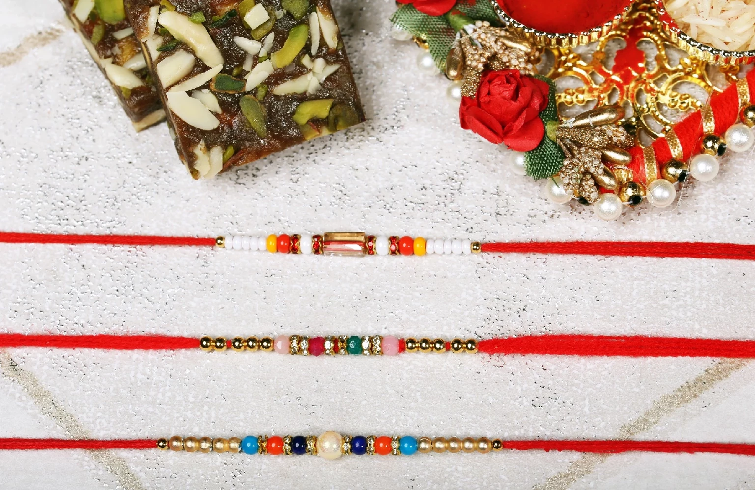 Graceful Beads and Kundan Rakhis - Image 1