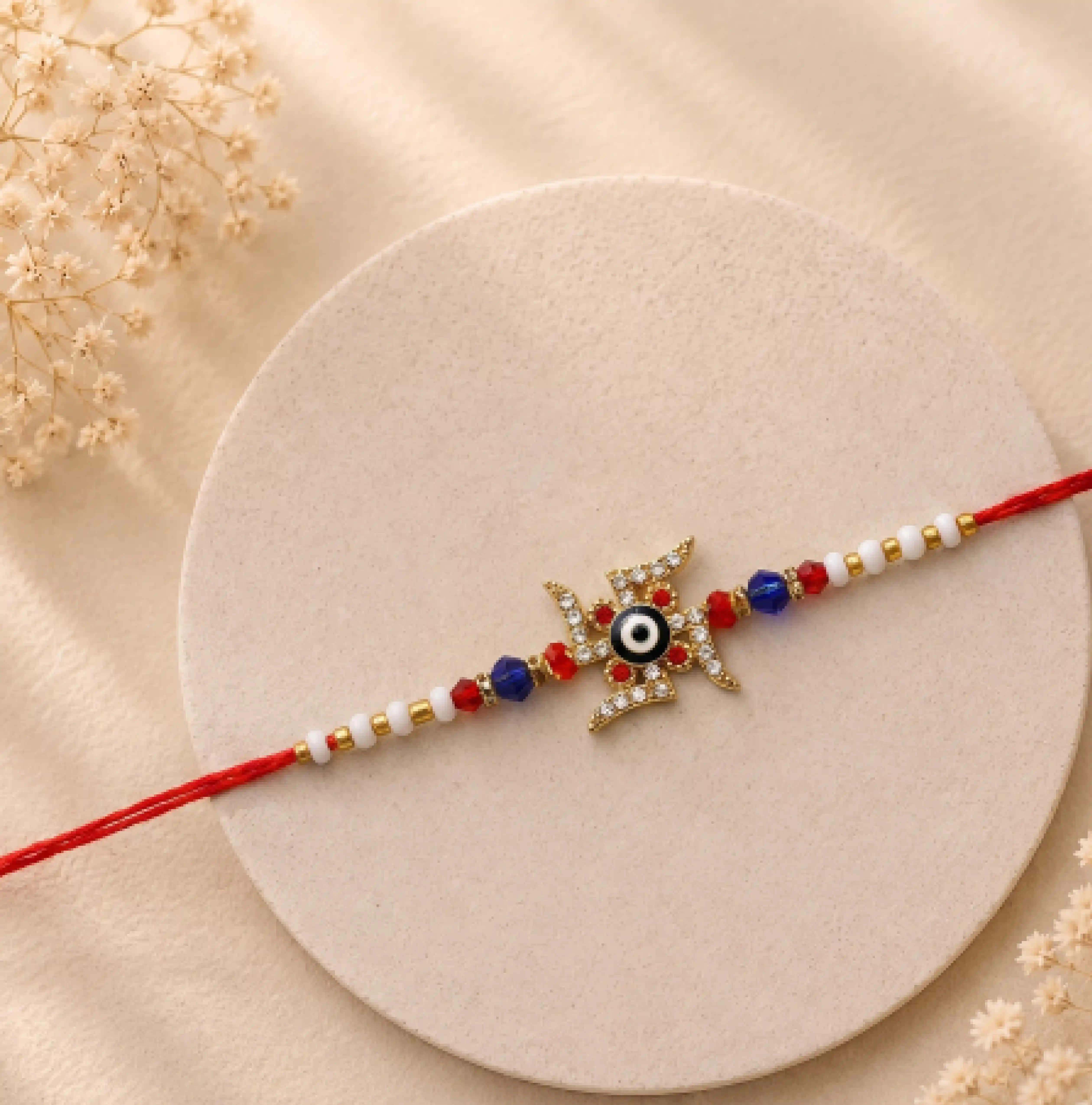 Swastik Rakhi with Evil Eye in Center